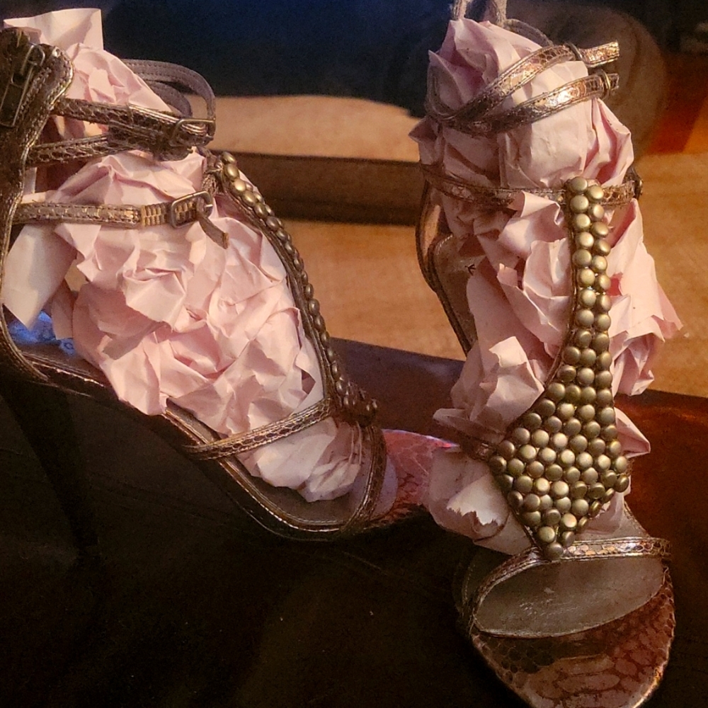Women's size 7.5M gladiator style Sam Edelman sandal metal and silver in color.